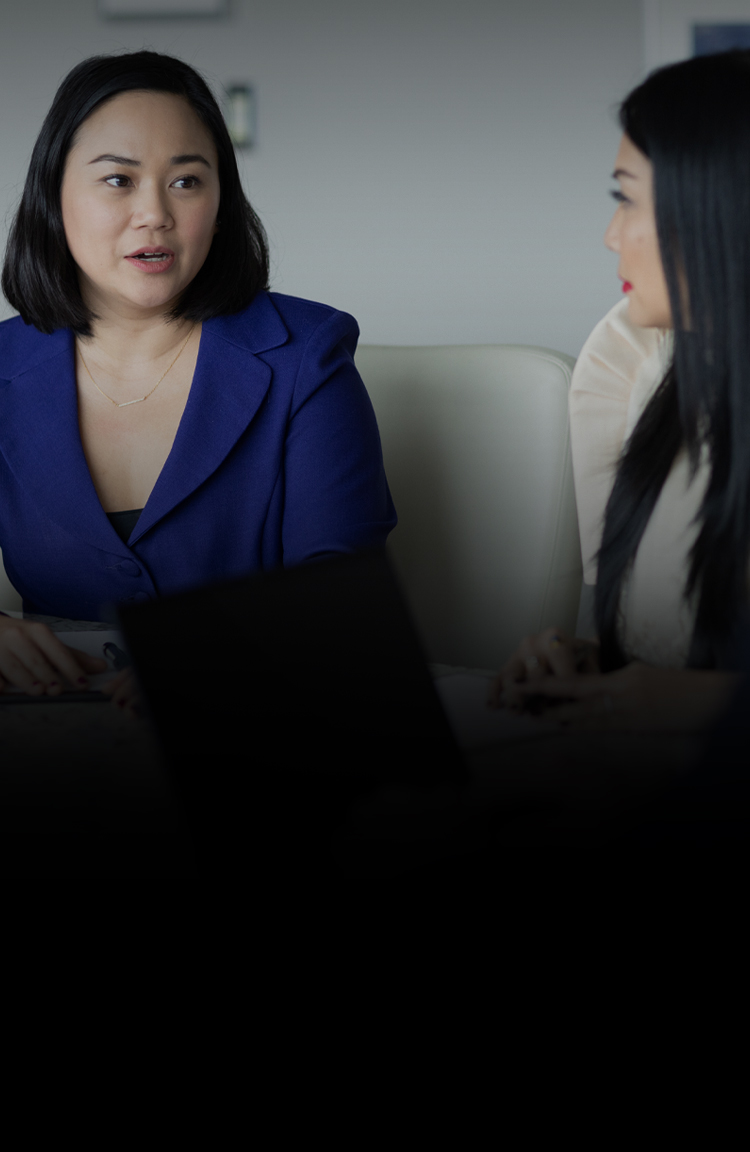 Attorneys consulting in conference room.
