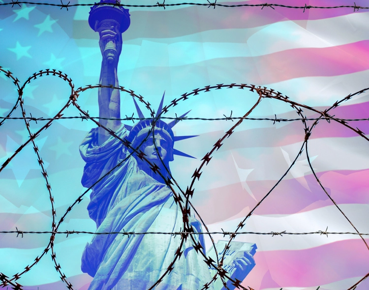 Statue of Liberty behind barbed wire to illustrate the US immigration travel ban