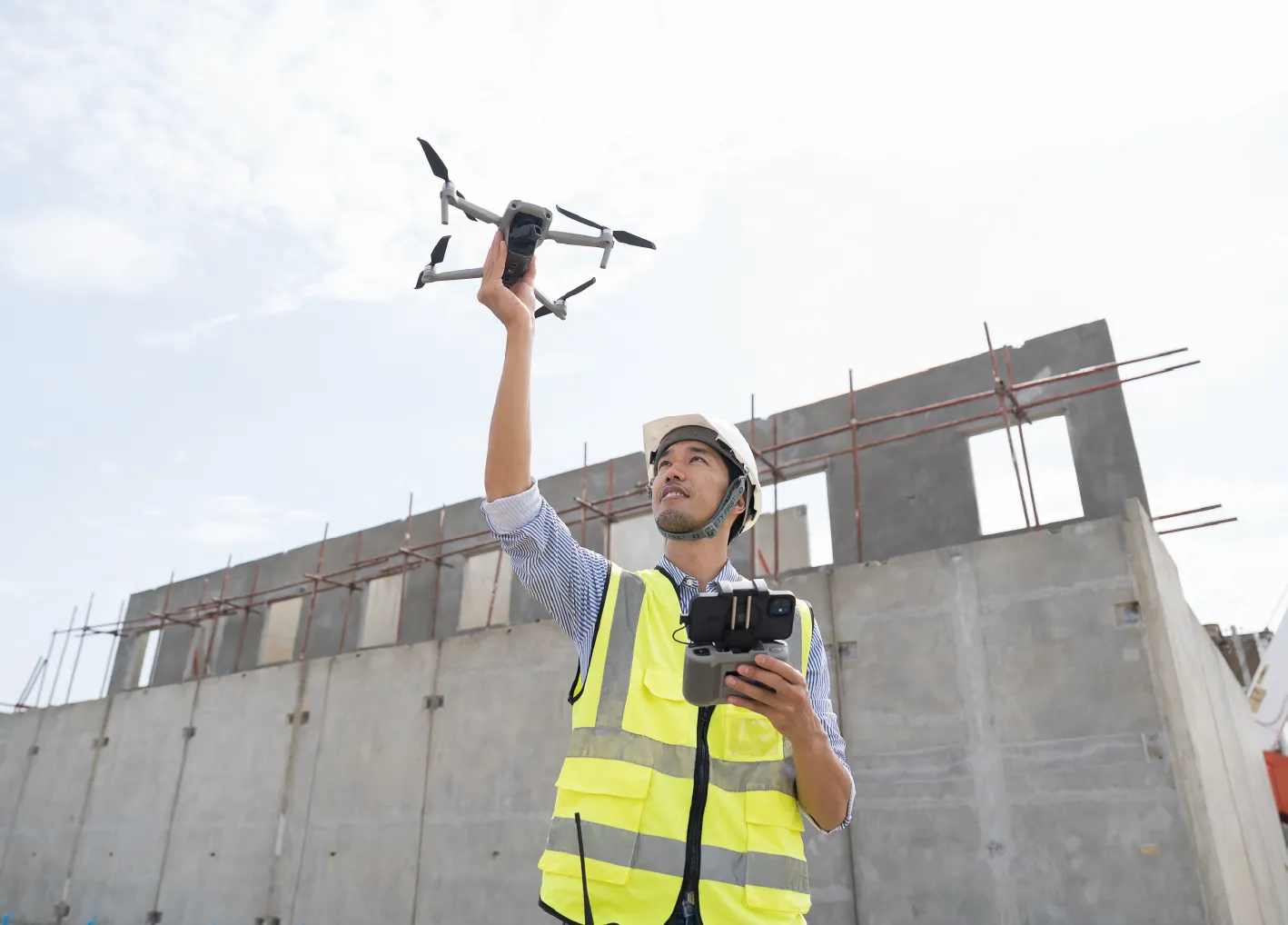 Construction engineer using drone supervising