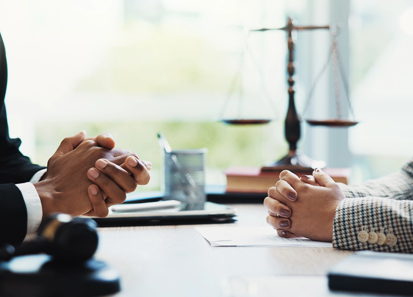 Gavel, lawyers and hands of business people in meeting for legal consultation