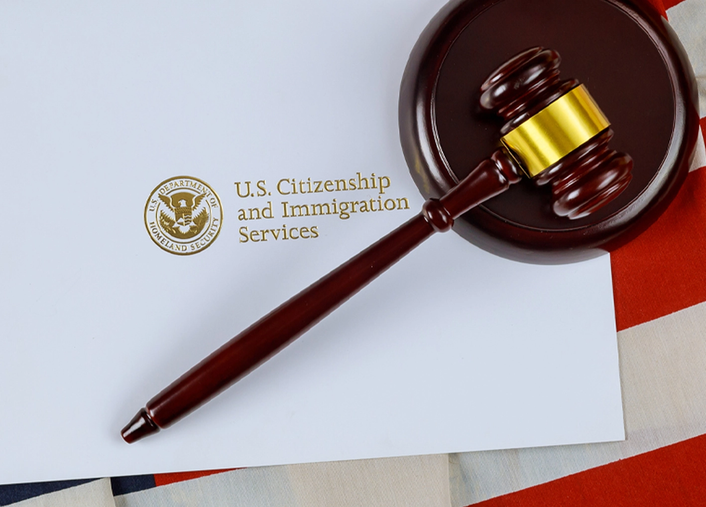 Judge's gavel over US immigration paperwork