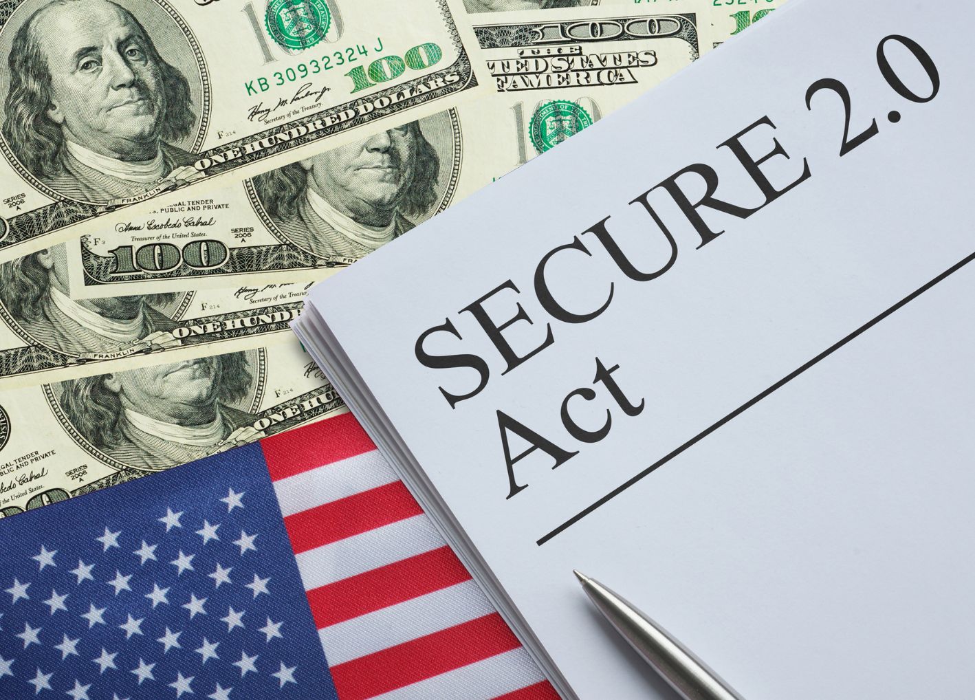 Secure 2.0 Act paper on top of money and American flag